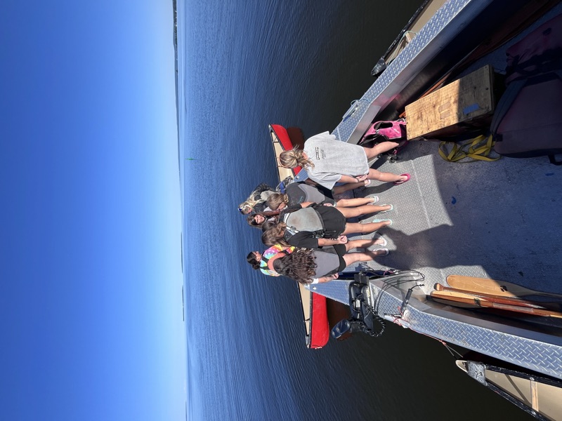 Lake Nipissing Outfitters charter boat on Lake Nipissing with canoe in tow