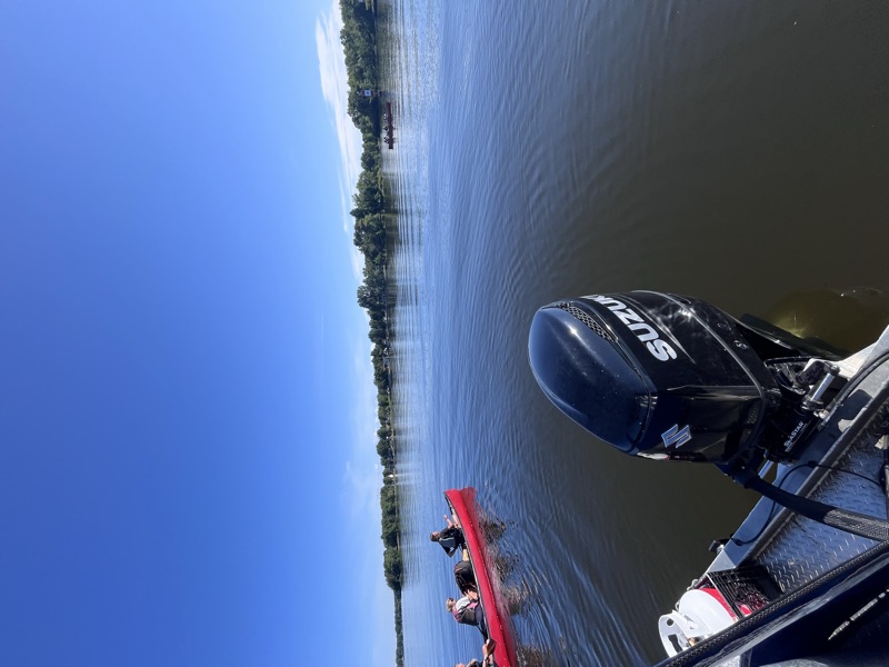 Canoe on calm Lake Nipissing shoreline on a guided paddle tour