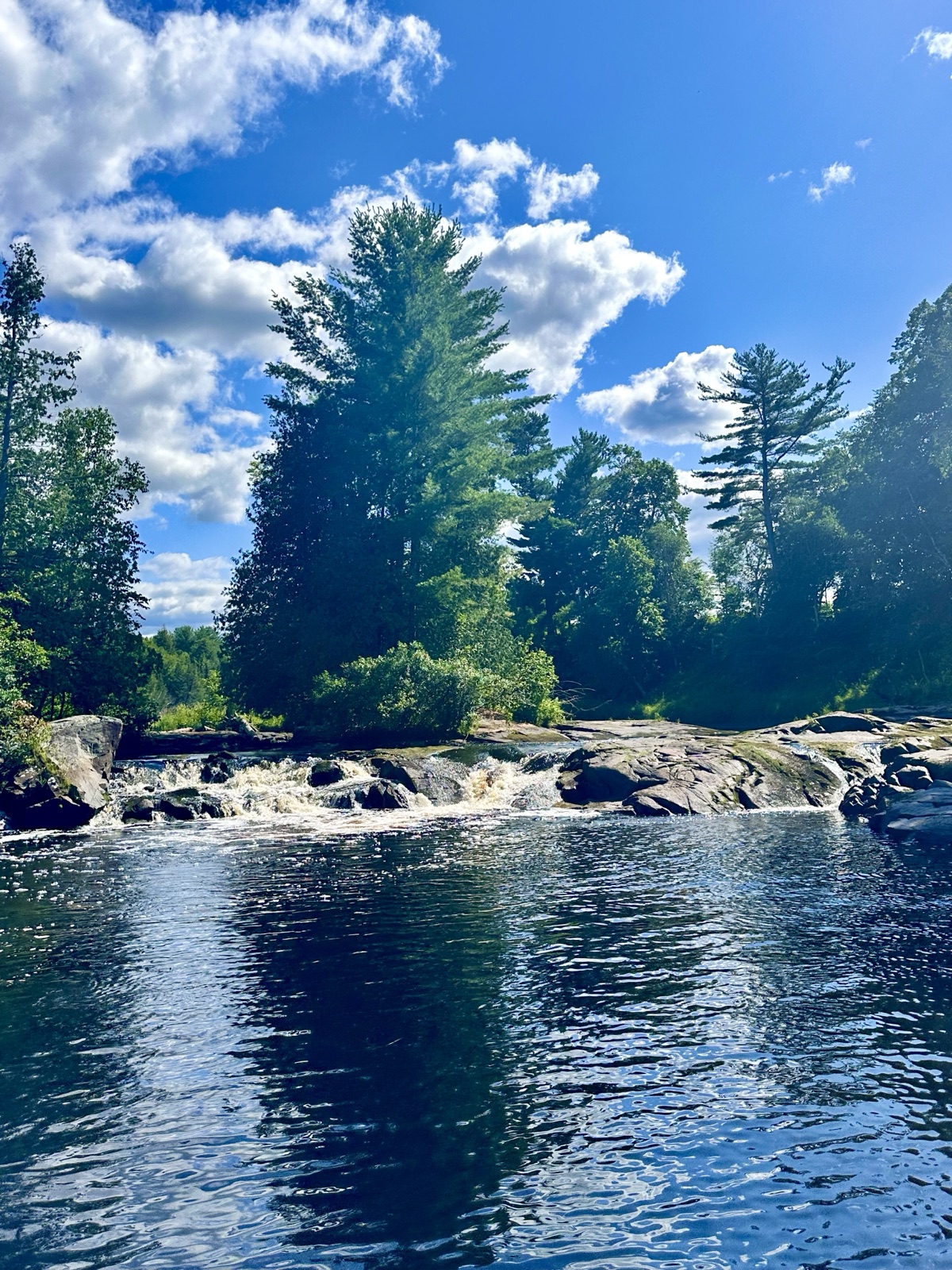 Calm river waters on the South River approaching Chapman's Chute waterfalls