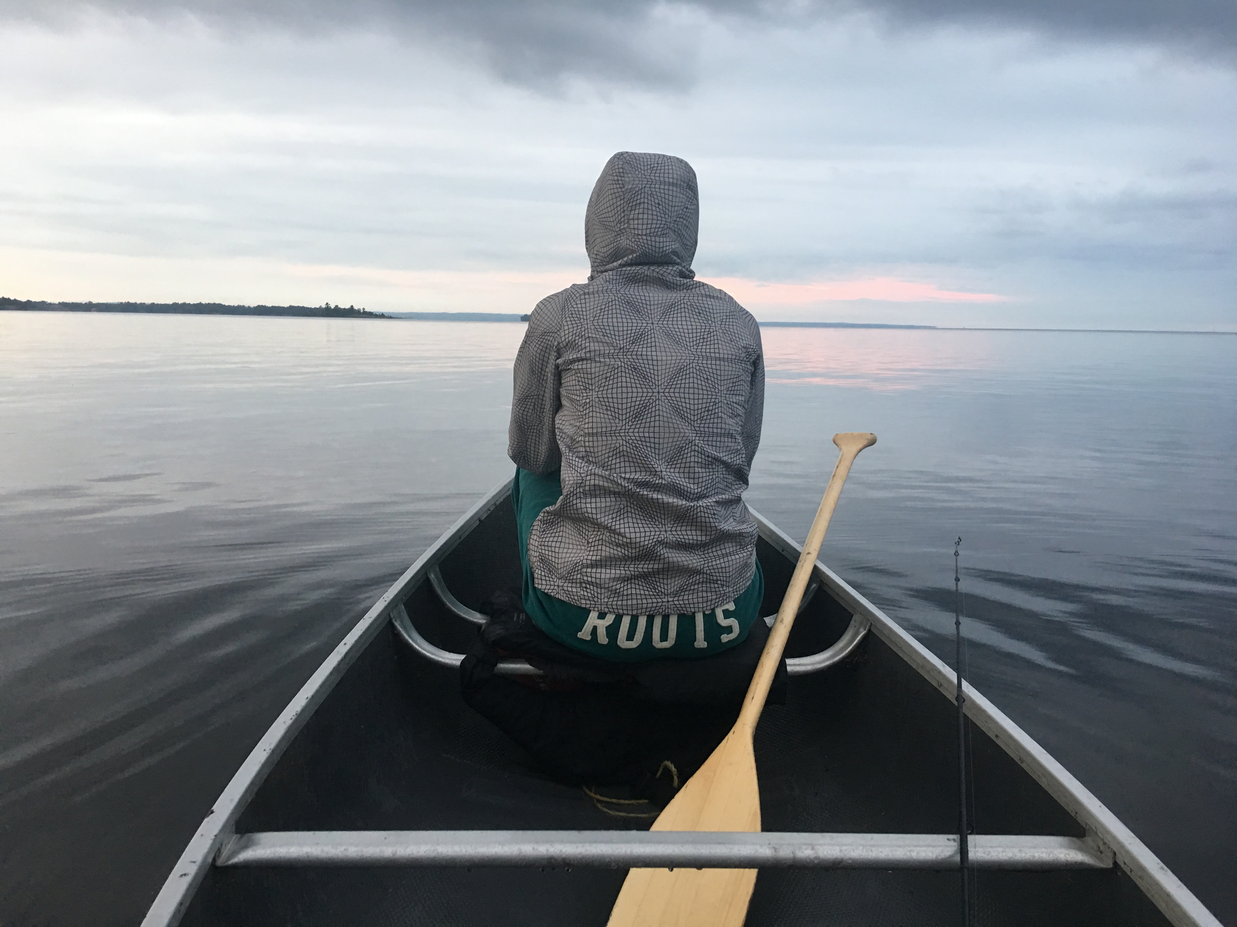 Canoe on Lake Nipissing shoreline ready for rental