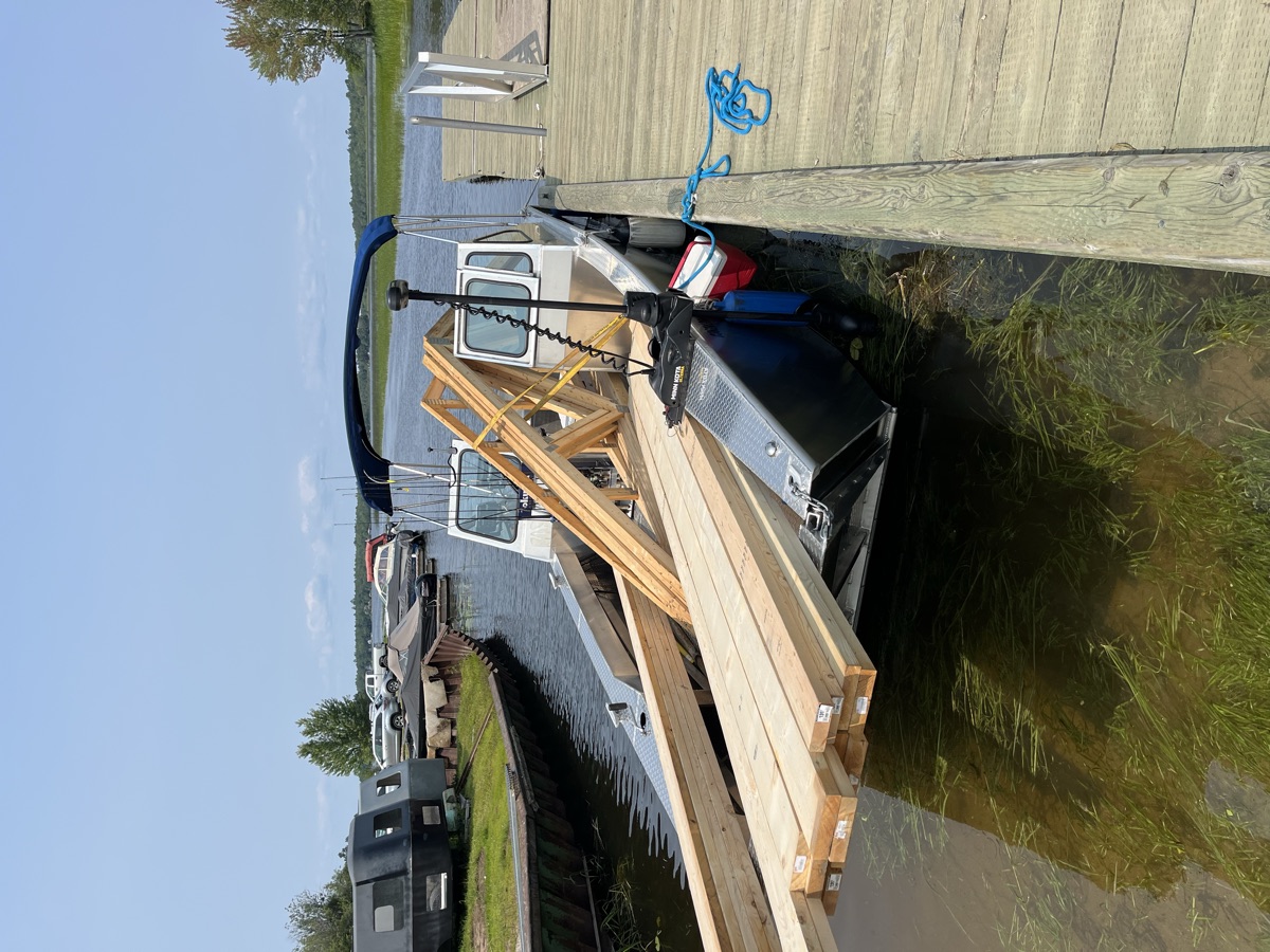 Boat loaded with lumber for delivery to a remote property